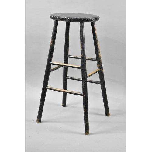 98 - A Vintage Black Painted Stool with Leather Studded Top, 75cms High