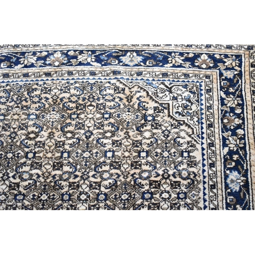 494 - A Persian Handmade Mehraban Carpet, 323x201cms