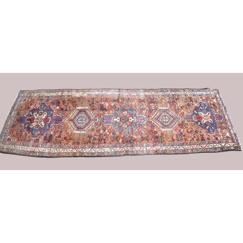 530 - A Persian Handmade Heriz Runner, 328x110cms