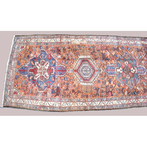 530 - A Persian Handmade Heriz Runner, 328x110cms