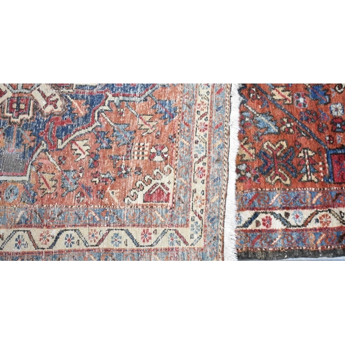 530 - A Persian Handmade Heriz Runner, 328x110cms