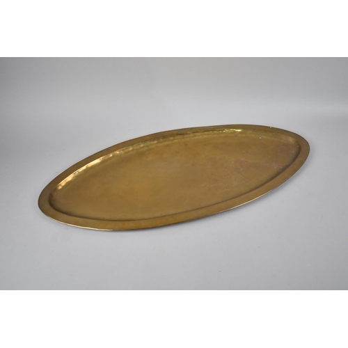 101 - An Edwardian Oval Brass Tray of Narrow Proportion, 64cms Long