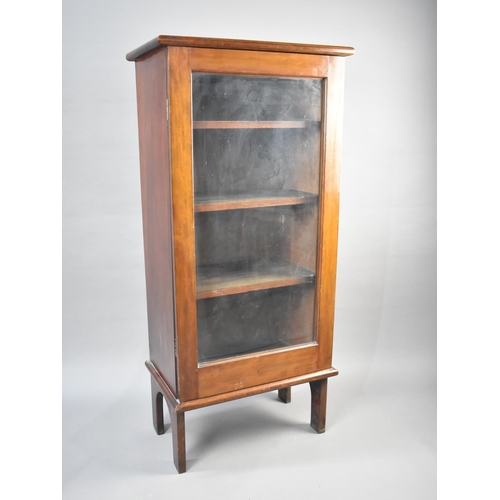 106 - An Edwardian Mahogany Glazed Three Shelf Bookcase, 57cms Wide and 123cms High