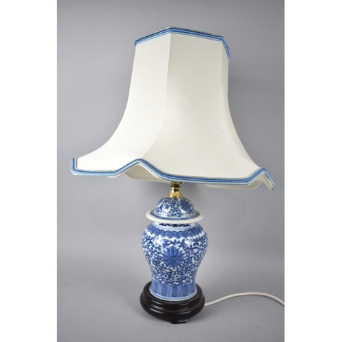 143 - A Modern Oriental Blue and White Vase Shaped Table Lamp with Shade, 52cms High Overall