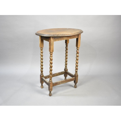 146 - An Edwardian Oak Oval Topped Occasional Table with Barley Twist Supports, 57cms Long