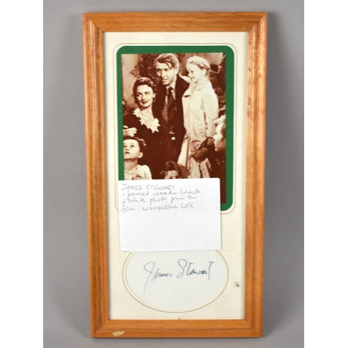 189 - A Framed Wonderful Life Photo together with Card Signature by James Stewart