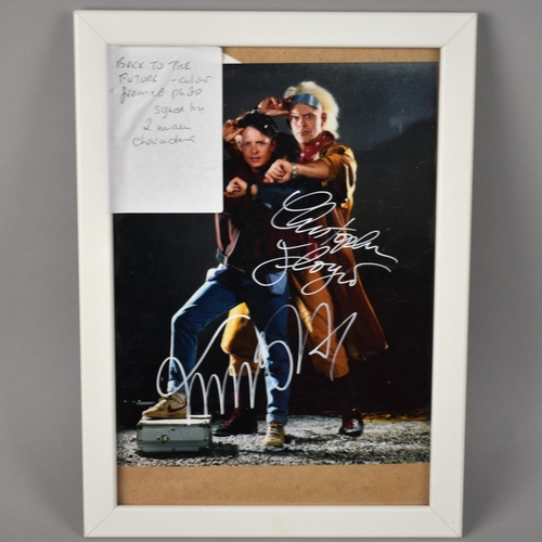 191 - A Framed Colour Photograph from Back to The Future Signed by Michael J Fox and Christopher Lloyd