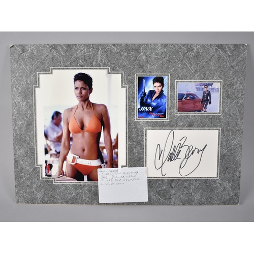 199 - Three Mounted Photographs of Halle Berry together with an Autographed White Card