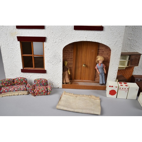 242 - A Late 20th Century Dolls House with Small Collection of Furniture, 76cms Wide and 48cms High