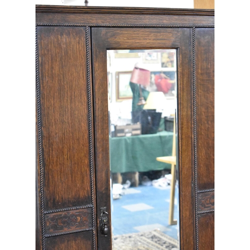 495 - An Edwardian Oak Mirror Fronted Single Wardrobe, 80cms Wide