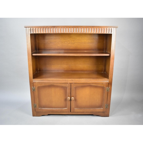 496 - A Mid 20th Century Oak Two Shelf Bookcase with Cupboard Base, 97cms Wide