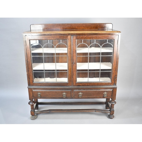 497 - An Edwardian Galleried Display Cabinet with Two Base Drawers, Leaded Glazed Doors, 107cms Wide