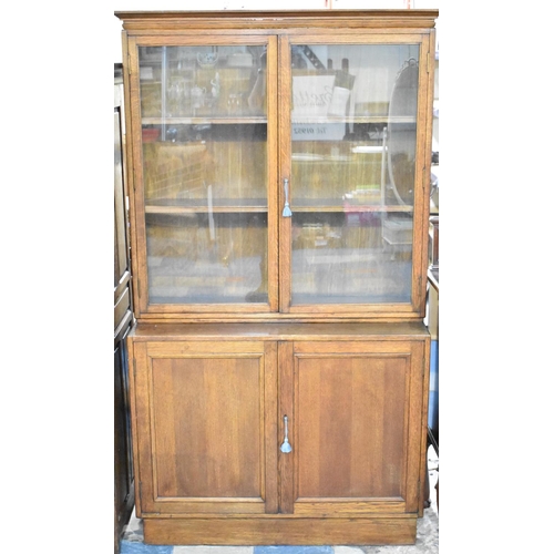 508 - An Edwardian Oak Glazed Bookcase with Cupboard Base, 106cms Wide