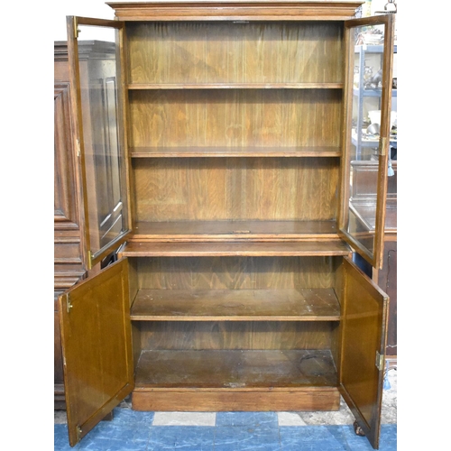 508 - An Edwardian Oak Glazed Bookcase with Cupboard Base, 106cms Wide