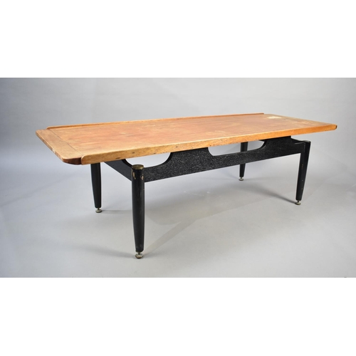 513 - A 1970s Teak Topped Coffee Table, 137x50cms