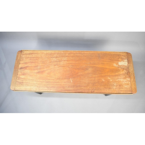 513 - A 1970s Teak Topped Coffee Table, 137x50cms