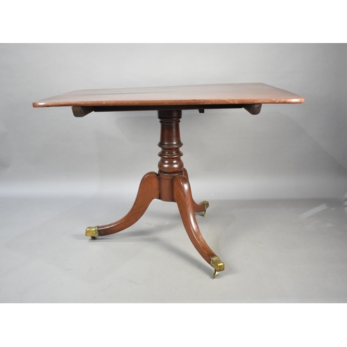 519 - A 19th Century Rectangular Snap Top Breakfast Table on Tripod Base, Brass Castors, 103cms by 85cms