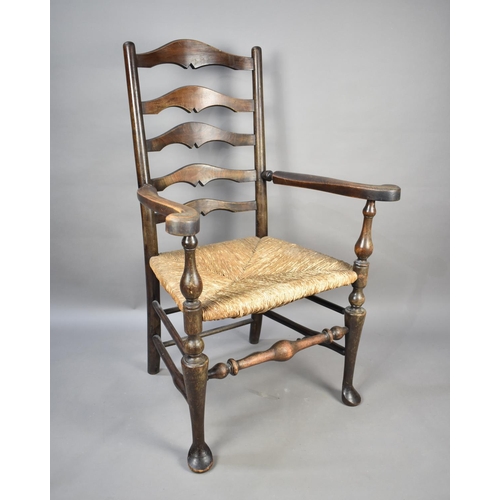 524 - A Late 19th/Early 20th Century Rush Seated Ladder Back Armchair