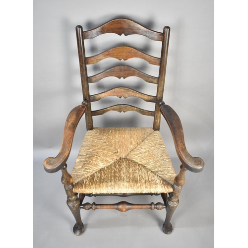 524 - A Late 19th/Early 20th Century Rush Seated Ladder Back Armchair