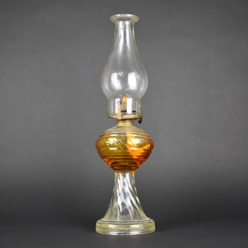 63 - An Early 20th Century Moulded Glass Oil Lamp, Made in Portugal, 42cms High