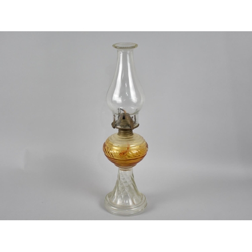 63 - An Early 20th Century Moulded Glass Oil Lamp, Made in Portugal, 42cms High