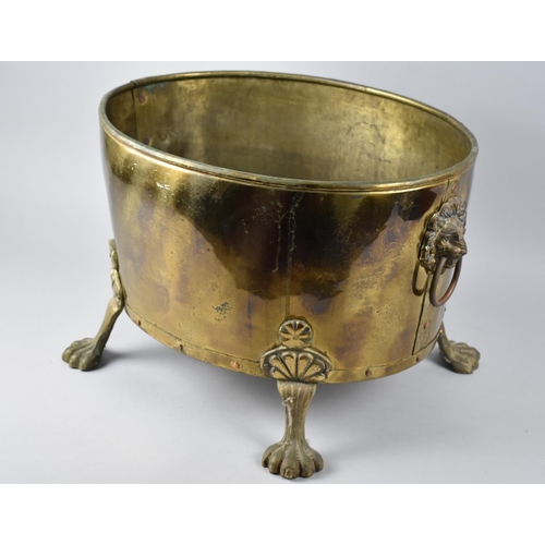 88 - A Late 20th Century Oval Brass Coal/Log Bucket with Four Claw Feet and Lion Mask Ring Handles, 42.5c... 