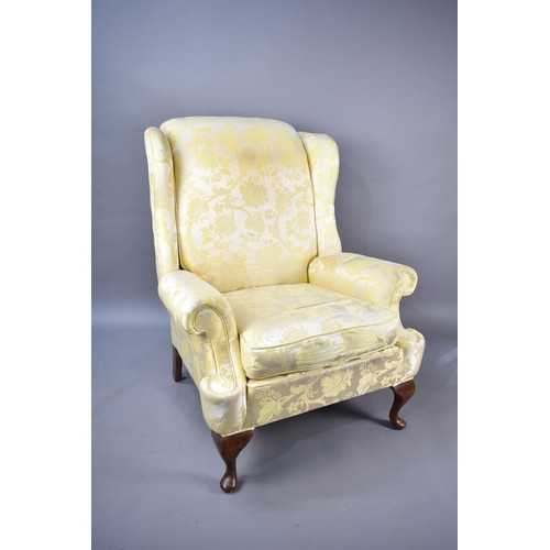 526 - A Mid 20th Century Upholstered Wing Armchair for Reupholstery