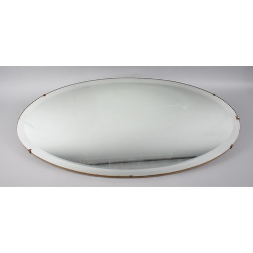 243 - A Vintage Oval Bevel Edged Wall Mirror, 73cms Wide