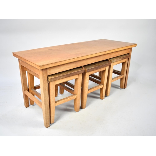 100 - A 1970's Nest of Four Tables, Top Cover Removes to Reveal Rush Top, 99cms Wide