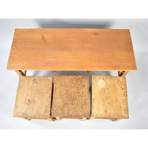 100 - A 1970's Nest of Four Tables, Top Cover Removes to Reveal Rush Top, 99cms Wide