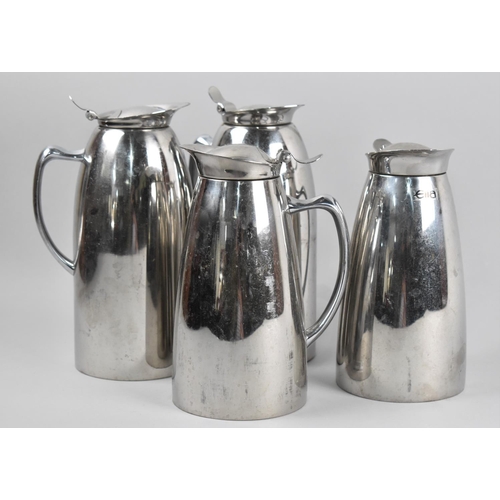 138 - A Set of Four Elia Stainless Steel Lidded Jugs, the Tallest 21cm high