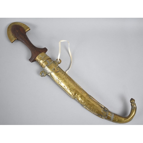 155 - An Indian Curved Blade Dagger with Brass Mounted Wooden Handle and Scabbard, 41cms Long