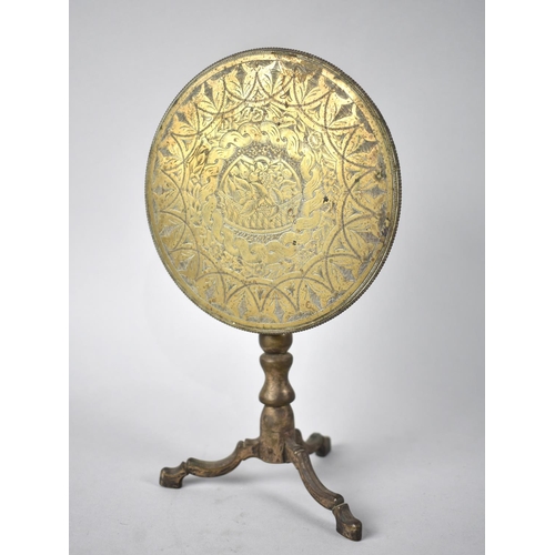 3 - A Georgian Brass Candle Reflector in the Form of a Snap Top Tripod Table, Engraved Disc Depicting Ba... 