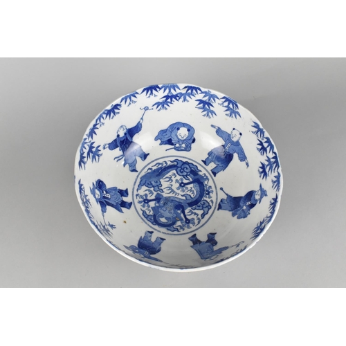 313 - A Chinese Blue and White Bowl Decorated with Figures and Central Dragon Motif, 25cm diameter