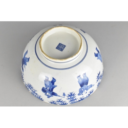 313 - A Chinese Blue and White Bowl Decorated with Figures and Central Dragon Motif, 25cm diameter