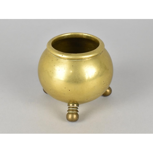 36 - A Brass Pot in the Form of a Three Legged Cauldron, 7cms High