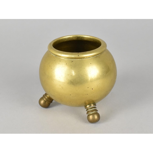 36 - A Brass Pot in the Form of a Three Legged Cauldron, 7cms High