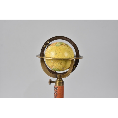 39 - A Small Reproduction Novelty Desktop Rise and Fall Globe as was Made in Paris by Gobille at Royal Pa... 