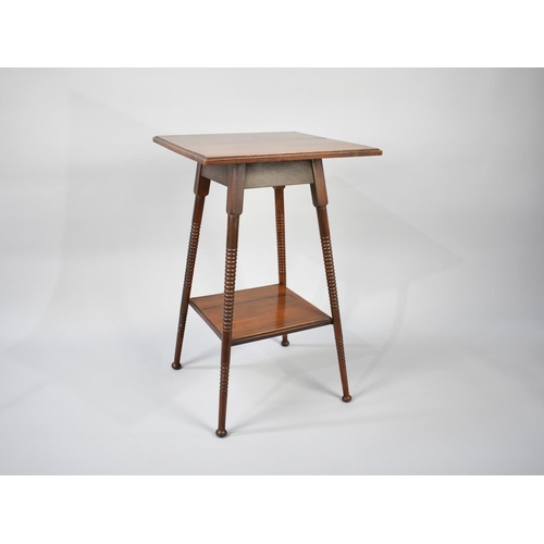 42 - An Edwardian Mahogany Square Topped Occasional Table with Bobbin Supports and Stretcher Shelf, 44cms... 