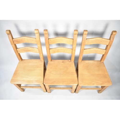 589 - A Set of Three Hardwood Ladder Back Dining Chairs