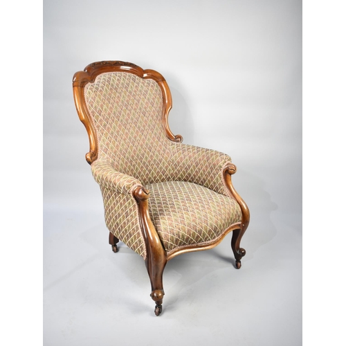 591 - A Victorian Mahogany Framed Ladies Armchair on Claw and Ball Feet Culminating to Casters, Later Upho... 