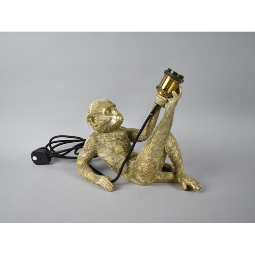 601 - A Modern Novelty Table Lamp Base in the Form of a Reclining Monkey, 35cms Long