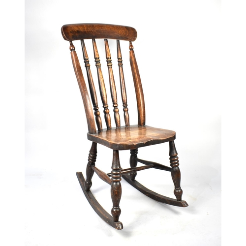 607 - A 19th Century Elm Seated Spindle Back Rocking Chair