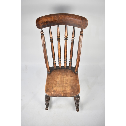 607 - A 19th Century Elm Seated Spindle Back Rocking Chair