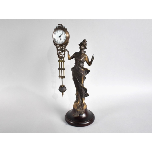 71 - A Reproduction Bronze Mystery Clock in the Form of a Standing Art Nouveau Maiden, 33cms High, Moveme... 