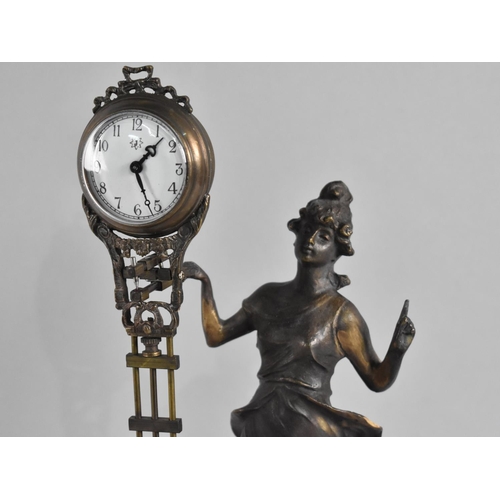 71 - A Reproduction Bronze Mystery Clock in the Form of a Standing Art Nouveau Maiden, 33cms High, Moveme... 