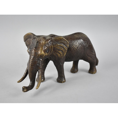 80 - A Large Heavy Patinated Bronze Study of a Bull Elephant, 30cms Long