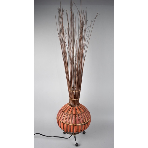 98 - A Modern Table Lamp formed From Reeds and Iridescent Material, 88cms High