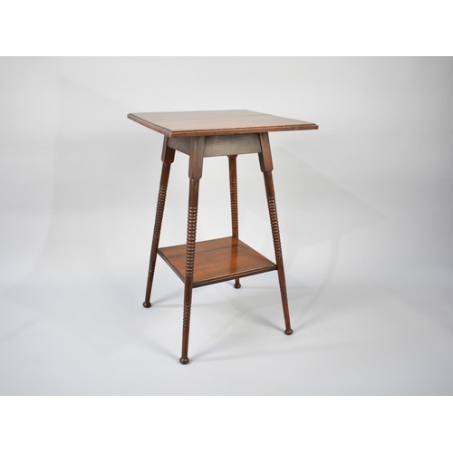 80 - An Edwardian Mahogany Square Topped Occasional Table with Bobbin Supports and Stretcher Shelf, 44cms... 