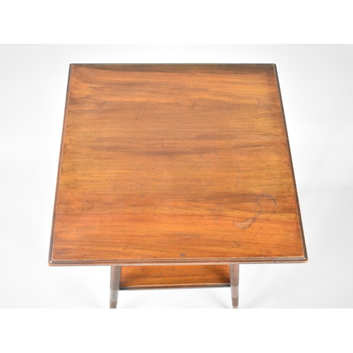 80 - An Edwardian Mahogany Square Topped Occasional Table with Bobbin Supports and Stretcher Shelf, 44cms... 